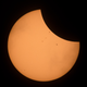 The International Space Station, with a crew of six onboard, is seen in silhouette as it transits the Sun at roughly five miles per second during a partial solar eclipse on Aug. 21, 2017 near Banner, Wyoming.